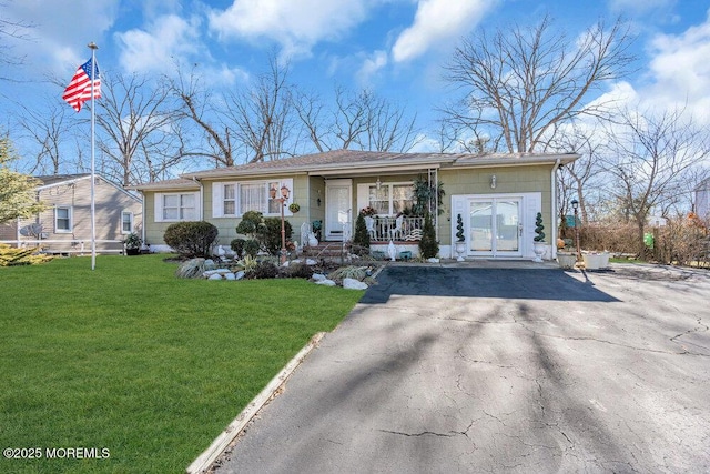 426 Shady Ln, Howell, NJ 07731 - ranch-style home featuring covered porch and a front yard