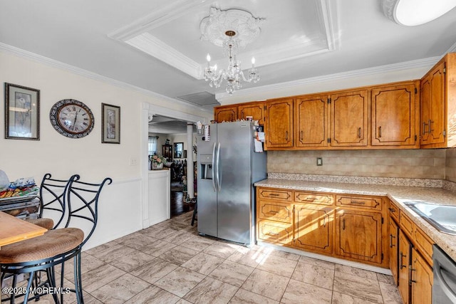 426 Shady Ln, Howell, NJ 07731 - kitchen with crown molding, appliances with stainless steel finishes, a tray ceiling, and backsplash