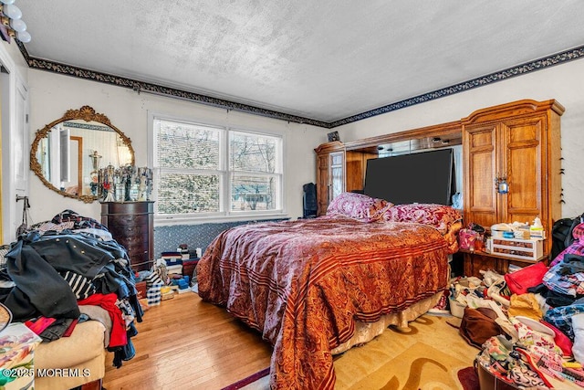 426 Shady Ln, Howell, NJ 07731 - bedroom with a textured ceiling and light wood-type flooring