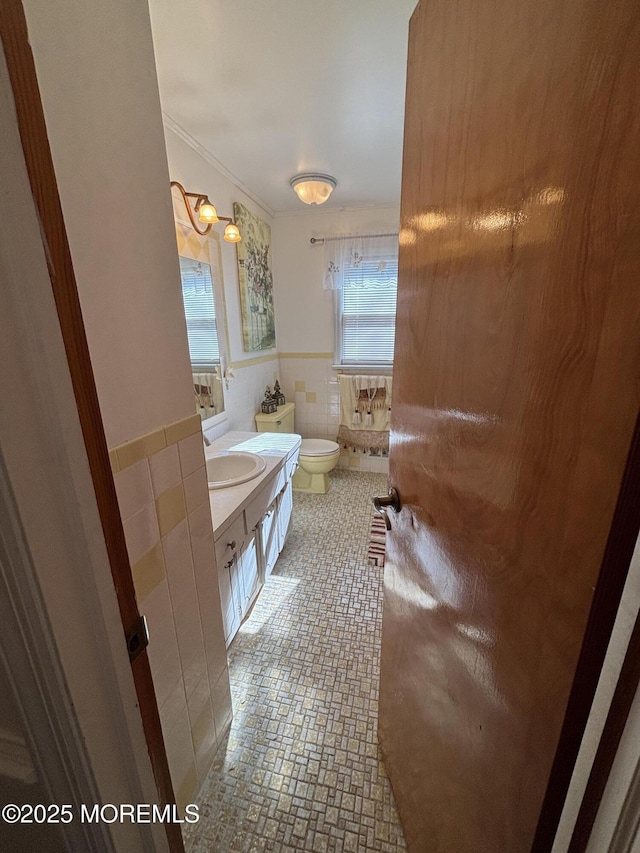 426 Shady Ln, Howell, NJ 07731 - bathroom with ornamental molding, vanity, toilet, and tile walls