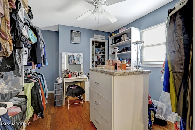 spacious closet featuring dark wood-style floors and ceiling fan