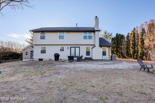 back of property with central AC unit