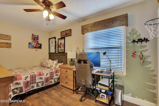 bedroom featuring hardwood / wood-style floors and ceiling fan