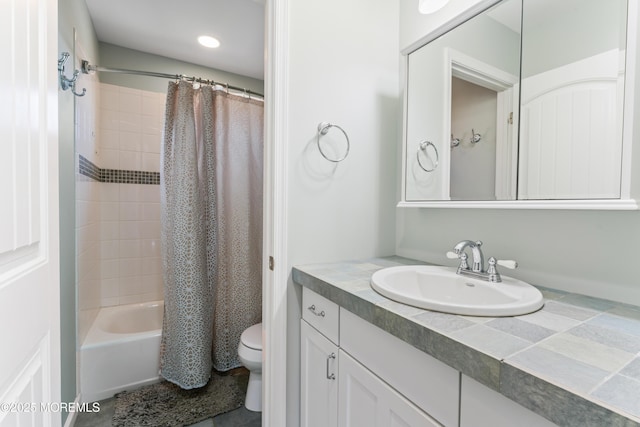 full bathroom with vanity, toilet, and shower / bath combo with shower curtain