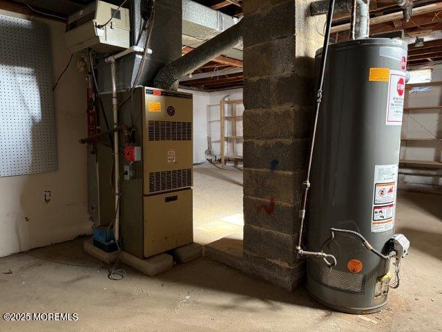 utility room featuring gas water heater