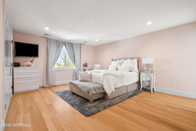 bedroom featuring light hardwood / wood-style floors