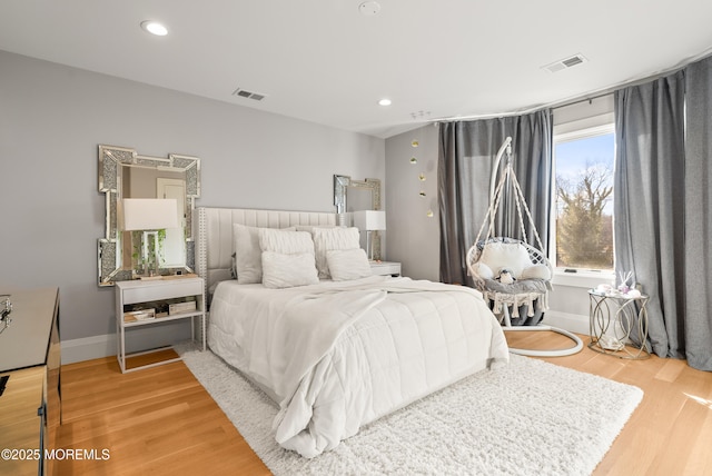 bedroom with wood-type flooring