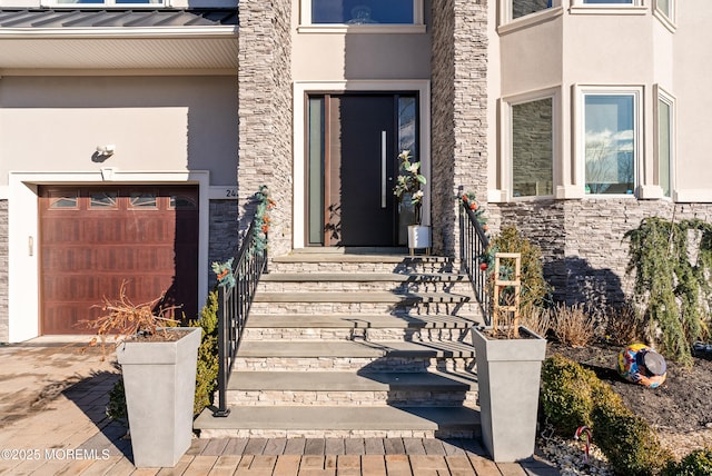 doorway to property featuring a garage