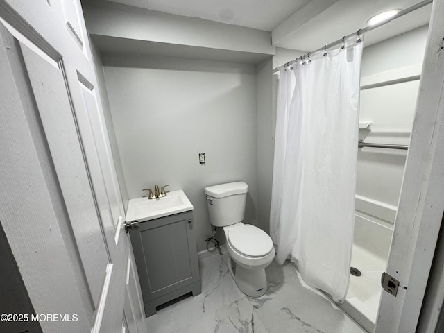 bathroom featuring vanity, a shower with shower curtain, and toilet