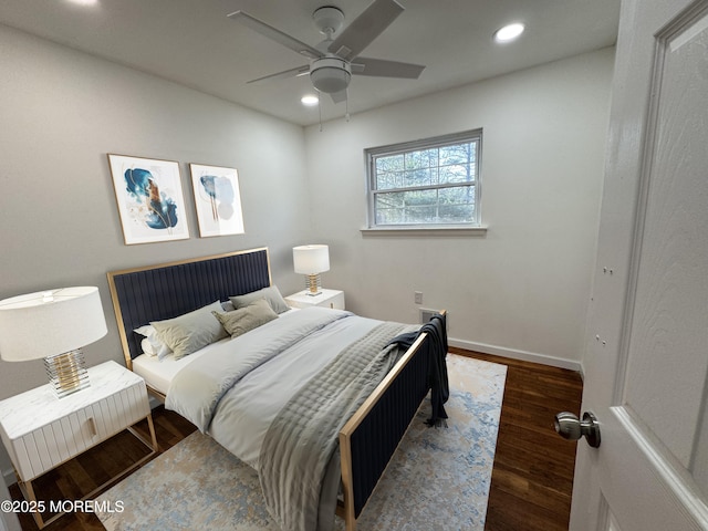 bedroom with ceiling fan and dark hardwood / wood-style floors