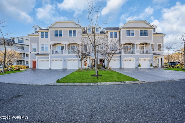 93 Golden Eye Ln, Port Monmouth, NJ 07758 - view of front of home featuring an attached garage, driveway, and a front lawn