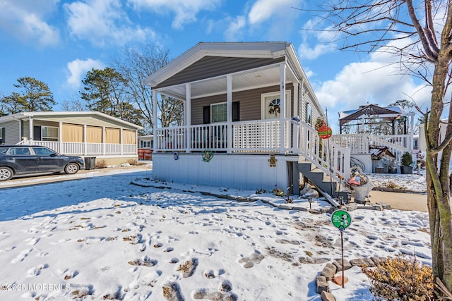 manufactured / mobile home featuring covered porch