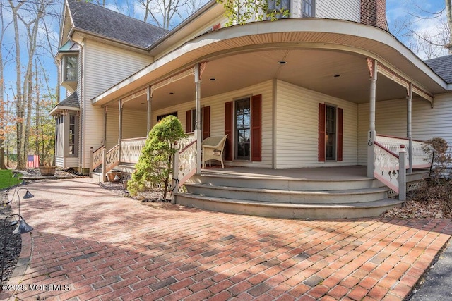 property entrance with covered porch