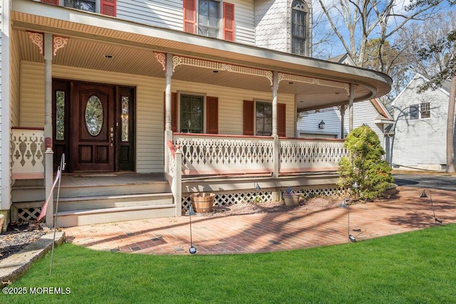 doorway to property featuring covered porch