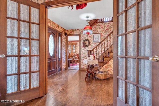 entrance foyer featuring hardwood / wood-style floors and french doors