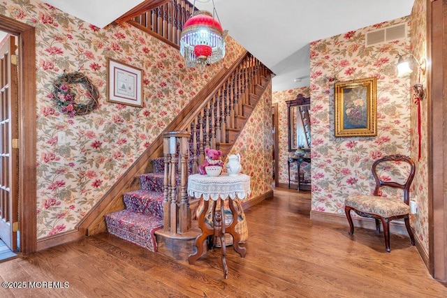 stairway featuring hardwood / wood-style flooring