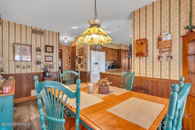 dining space featuring dark hardwood / wood-style floors