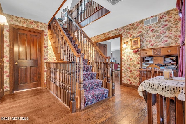 staircase featuring hardwood / wood-style floors