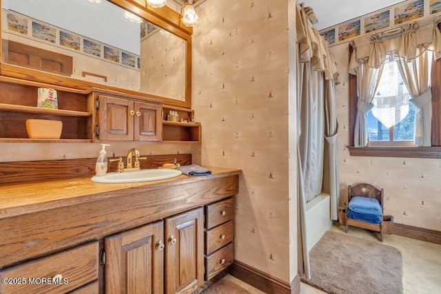 bathroom with vanity and shower / tub combo