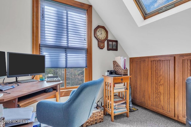 office featuring lofted ceiling with skylight and carpet floors