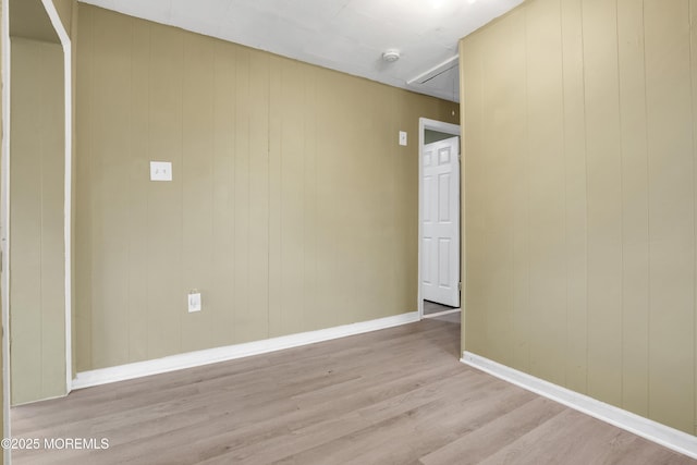 spare room with light wood-type flooring