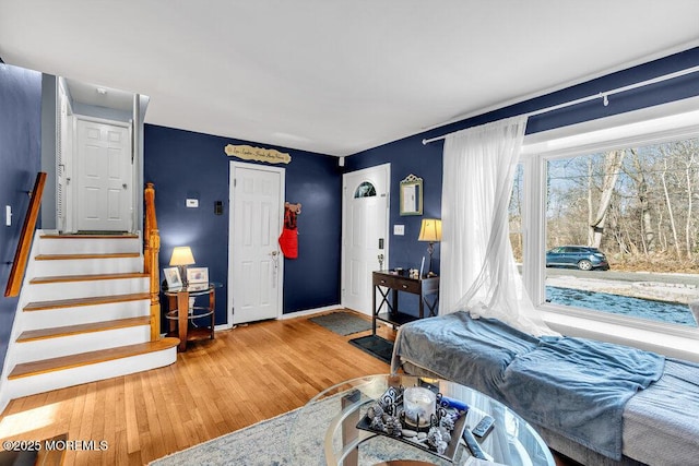 bedroom with hardwood / wood-style flooring