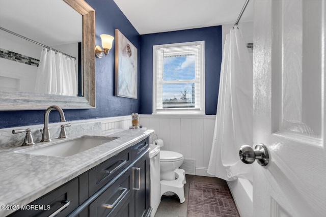 bathroom featuring vanity, toilet, and a shower with shower curtain