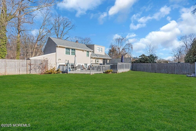 back of property with a patio area and a lawn