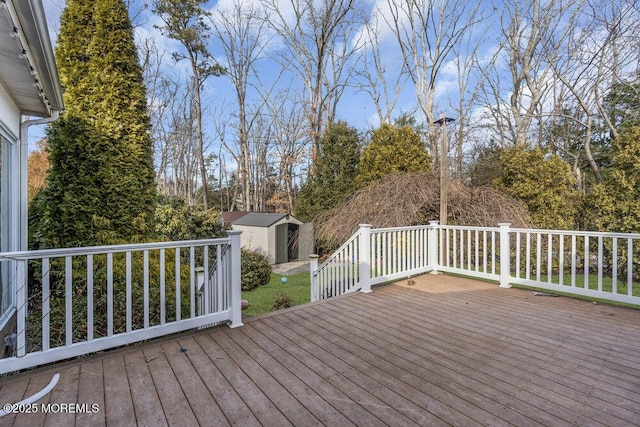 wooden deck with a storage shed