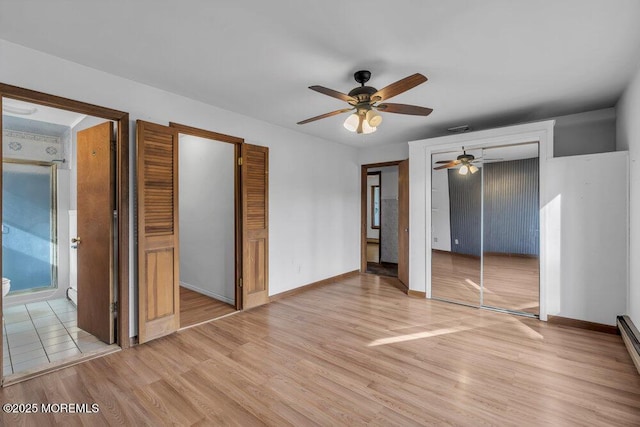 unfurnished bedroom featuring ceiling fan, light hardwood / wood-style floors, and a baseboard radiator