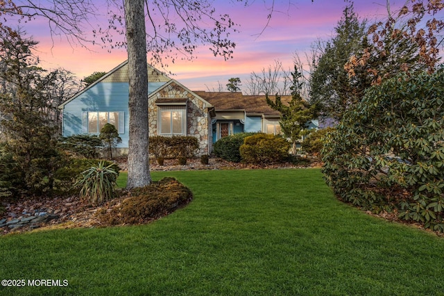 view of front of house with a lawn