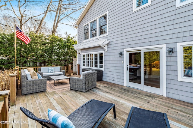 wooden deck featuring outdoor lounge area