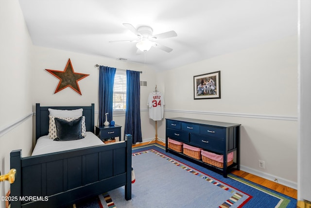 bedroom with wood-type flooring and ceiling fan