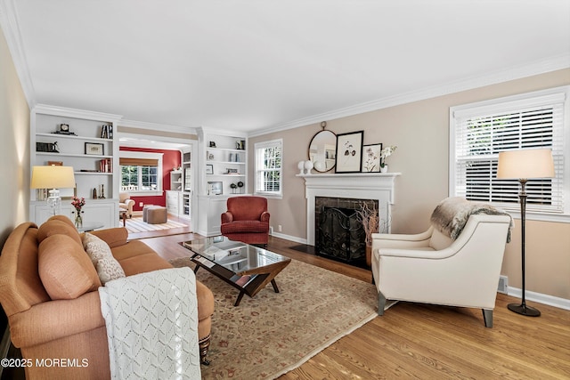 living room featuring hardwood / wood-style flooring and ornamental molding