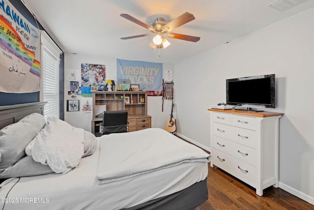 bedroom featuring dark hardwood / wood-style flooring and ceiling fan