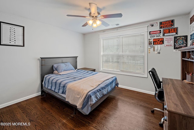 bedroom with ceiling fan and dark hardwood / wood-style flooring