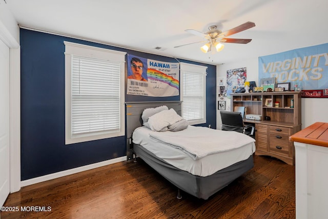 bedroom featuring ceiling fan and dark hardwood / wood-style flooring