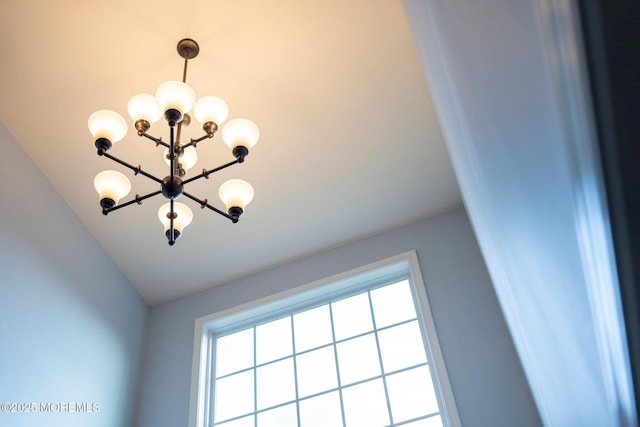 interior details with a chandelier