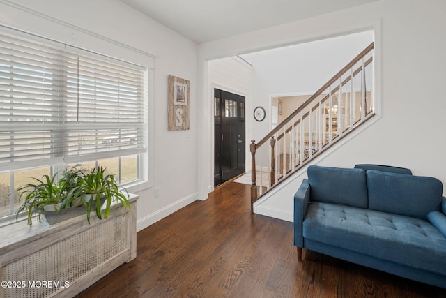 foyer entrance featuring dark hardwood / wood-style floors