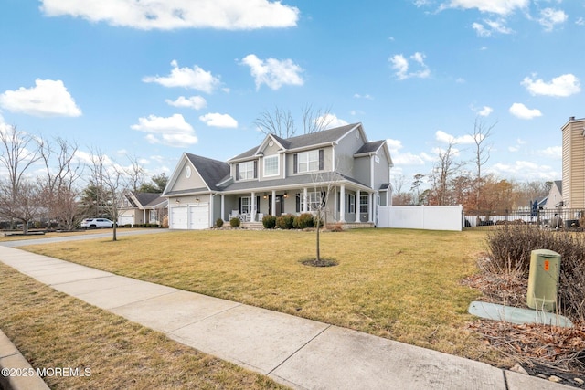 view of front of home with a garage, covered porch, and a front lawn