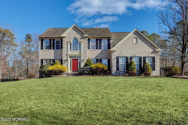 colonial-style house with a front lawn