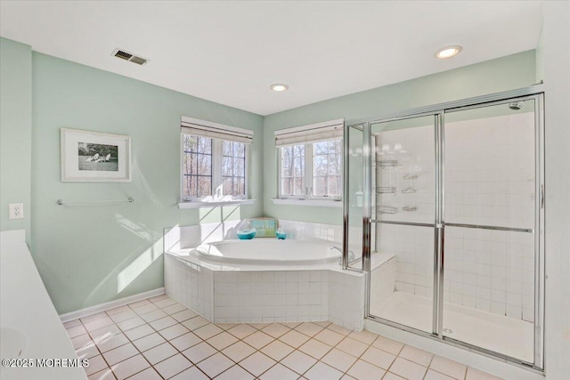 bathroom with separate shower and tub and tile patterned floors