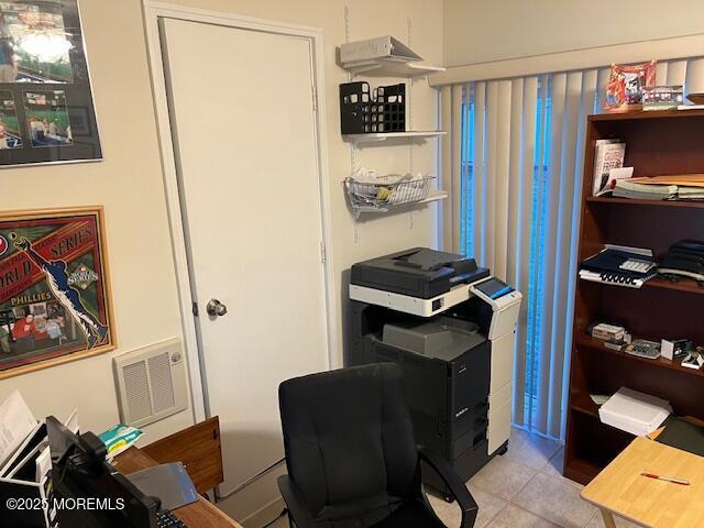 office area featuring light tile patterned flooring