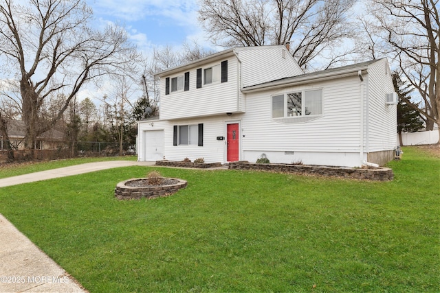 view of front of property with a garage, a fire pit, and a front yard