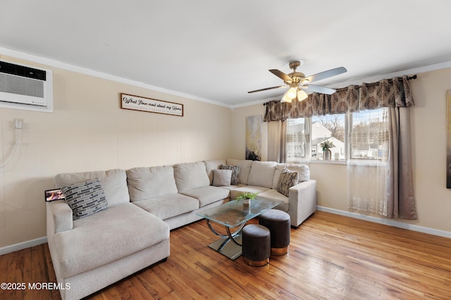 living room featuring hardwood / wood-style floors, crown molding, a wall mounted AC, and ceiling fan