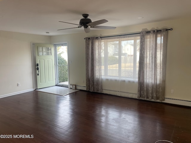 entrance foyer with a baseboard radiator, ceiling fan, and dark hardwood / wood-style flooring