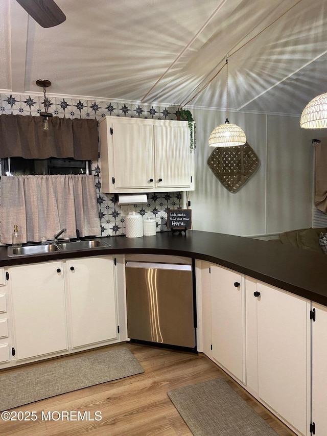 kitchen featuring white cabinetry, sink, and stainless steel dishwasher