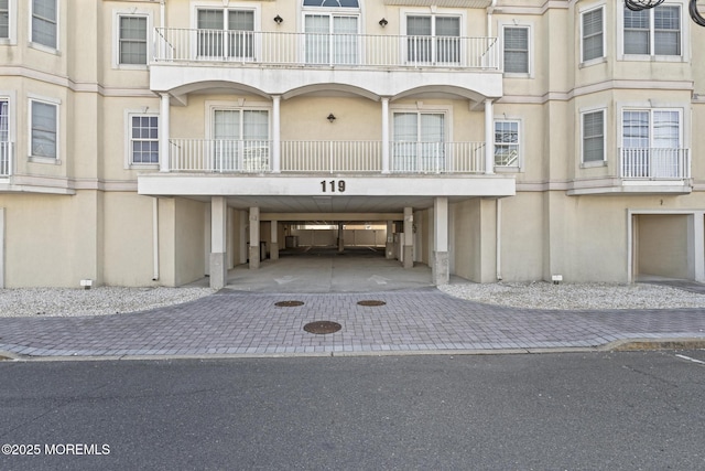 exterior space with a carport and driveway