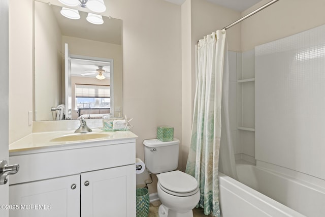 ensuite bathroom with a ceiling fan, toilet, shower / tub combo with curtain, ensuite bathroom, and vanity