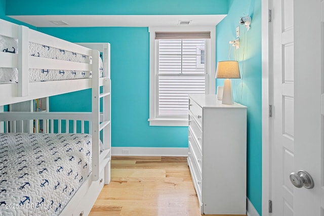 bedroom with light hardwood / wood-style flooring